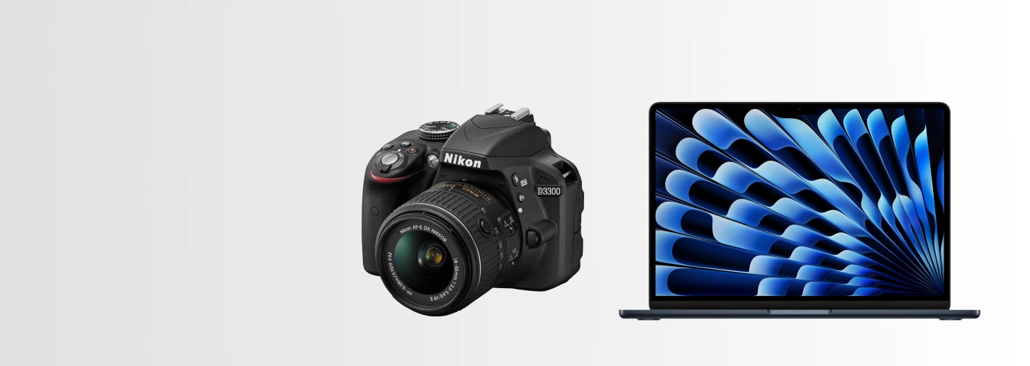 Nikon camera with mac to the right on a banner light gradient background